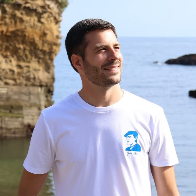 Artxiboak white t-shirt with Basque-inspired blue logo